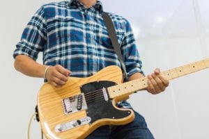 Man guitar player on acoustic electric guitar