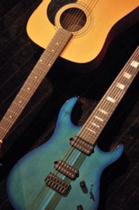 Acoustic guitar and Teal colored electric guitar